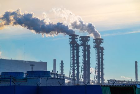 A chemical plant spews air pollution